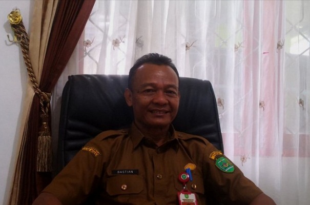 Kepala Dinas Ketahanan Pangan Kabupaten Tapin Bastian saat berada di ruangannya